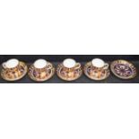 A set of four Royal Crown Derby 1128 pattern coffee cup and saucers;