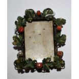 A miniature Victorian photograph frame, decorated with leaves and berries,