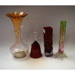 A late 19th century glass vase, a similar bud vase, a 1970's red glass vase,