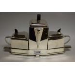 An Art Deco style three piece tea/coffee service on stand