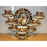 A Royal Crown Derby 1128 tea service for six, with cups, saucers, side plates, cake plate,