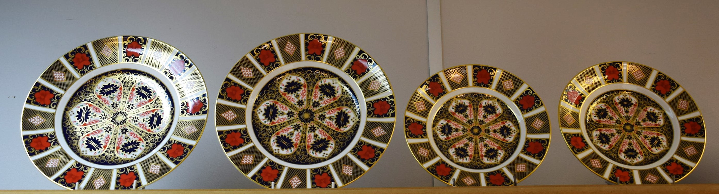 Royal Crown Derby - a pair of 1128 Imari 26.5cm dinner plates; a smaller pair, 21.