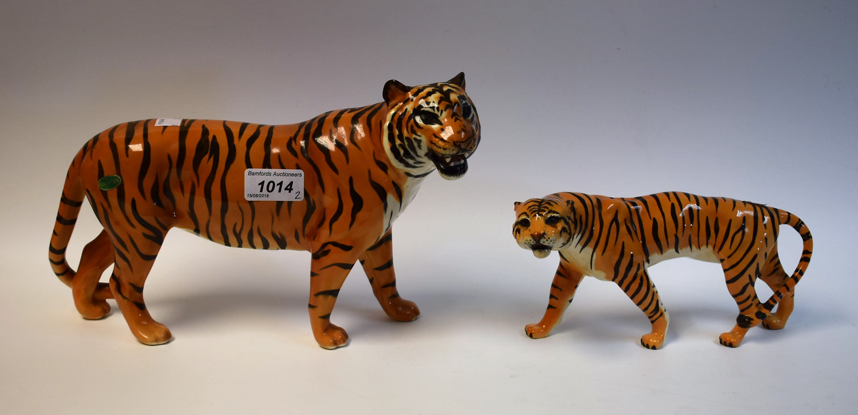 A large Beswick tiger and another,