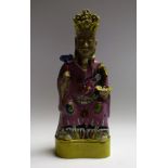 A Chinese figure, of an official, seated, holding ruyi sceptre,