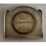 An Art Deco style silver coloured metal thermometer/barometer