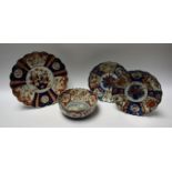 A Japanese export ware shaped circular Imari palette plate; a pair, similar,