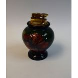 A Moorcroft hibiscus pattern table lighter, 11.