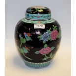 A Chinese famille noir ovoid ginger jar and cover, painted in polychrome with flowers,