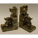 A pair of bookends, modelled as a cat and dog,