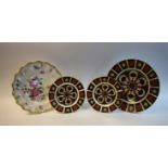 A Royal Crown Derby 1128 dinner plate; two 1128 side plates; another,