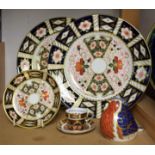 Royal Crown Derby - a paperweight, Robin, gold stopper; a miniature 1128 Imari cup and saucer,