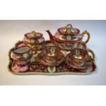 A Vienna porcelain tete a tete comprising teapot, cream jug, sucrier,