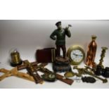 Boxes and Objects - a cast metal swinger clock modelled as a peasant holding pendulum;