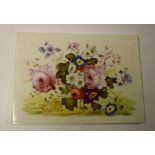 An English porcelain rectangular plaque, painted with colourful summer flowers,