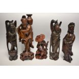A pair of Chinese hardwood figures, each carved as an immortal, inlaid throughout with silver wire,