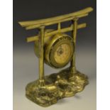 A late 19th century bronze mantel clock,