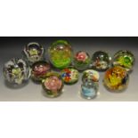 Decorative paperweights - an unusual paperweight with central flower and butterflies inclusion;