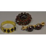 Jewellery - a yellow metal garnet dress ring; two stone garnet brooch;