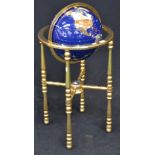 A large floor standing globe, semi-precious stone set on brass stand, approx.