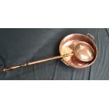 A 19th century copper circular preserve pan, with turned bar handles and rolled rim, c.