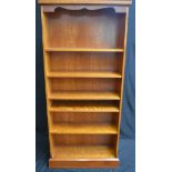 A reproduction yew wood bookcase