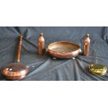A 19th century copper bed warmer; two copper cylinder hot water bottles; a brass chestnut roaster;