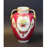 A Noritake twin handled vase, floral decorated, gilt detail, approx.