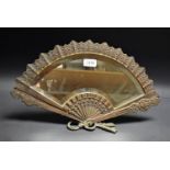 A brass fan shaped dressing table mirror,