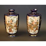 A pair of hexaganol satsuma vases, decorated with figures in a garden landscape,