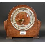 An oak mantel clock, Westminster chime, Arabic numerals,