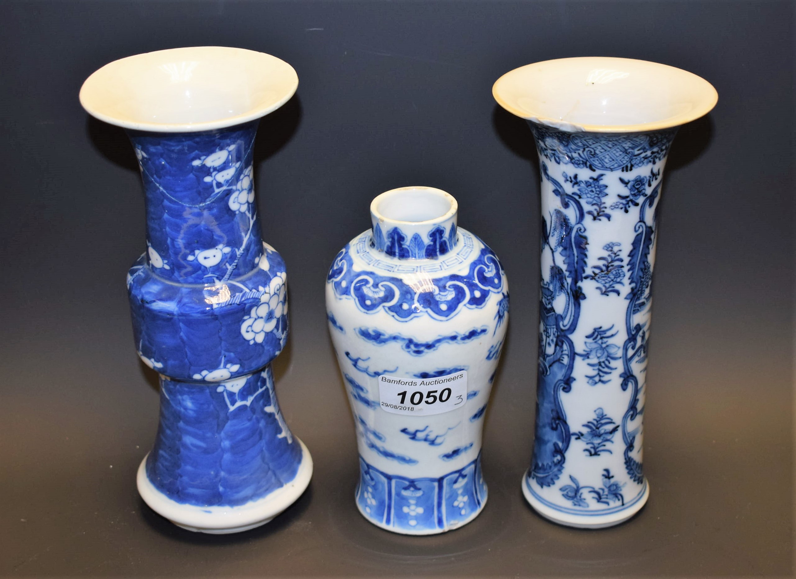 An 18th century Chinese sleeve vase, painted in underglaze blue with with pagodas in a landscape,