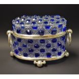 A blue and clear cut glass casket, white metal mounts,