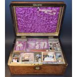 A burrwood and parquetry inlaid sewing box containing buttons and cottons