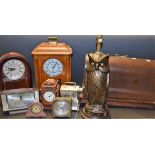 An early 20th century sewing machine; a Seiko Westminster Whittington quartz mantel clock;