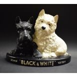 Advertising - a Black and White scotch whisky figural group