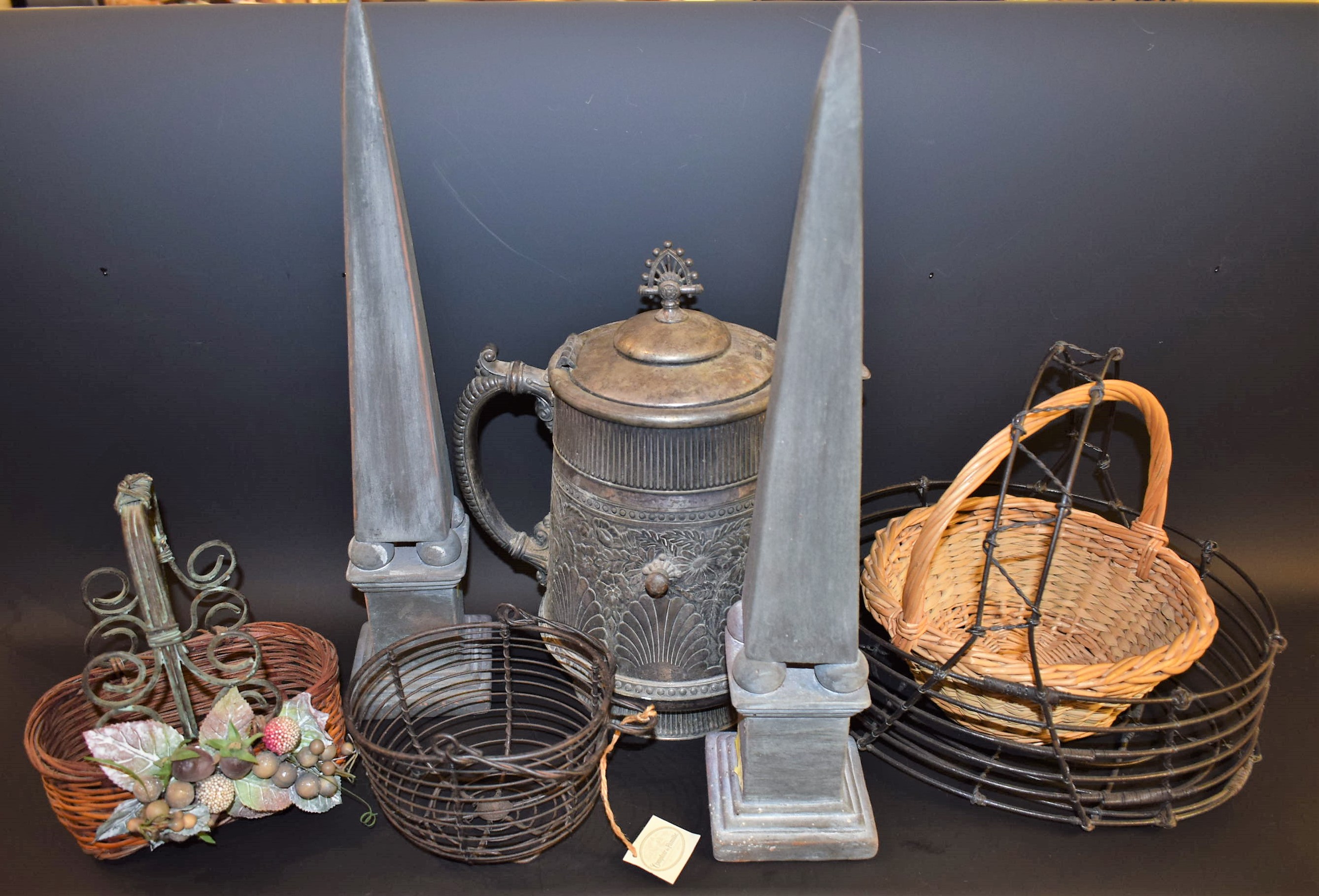 A large pewter type lidded flagon; a pair of ceramic obelisks; a leaded glass plant holder;