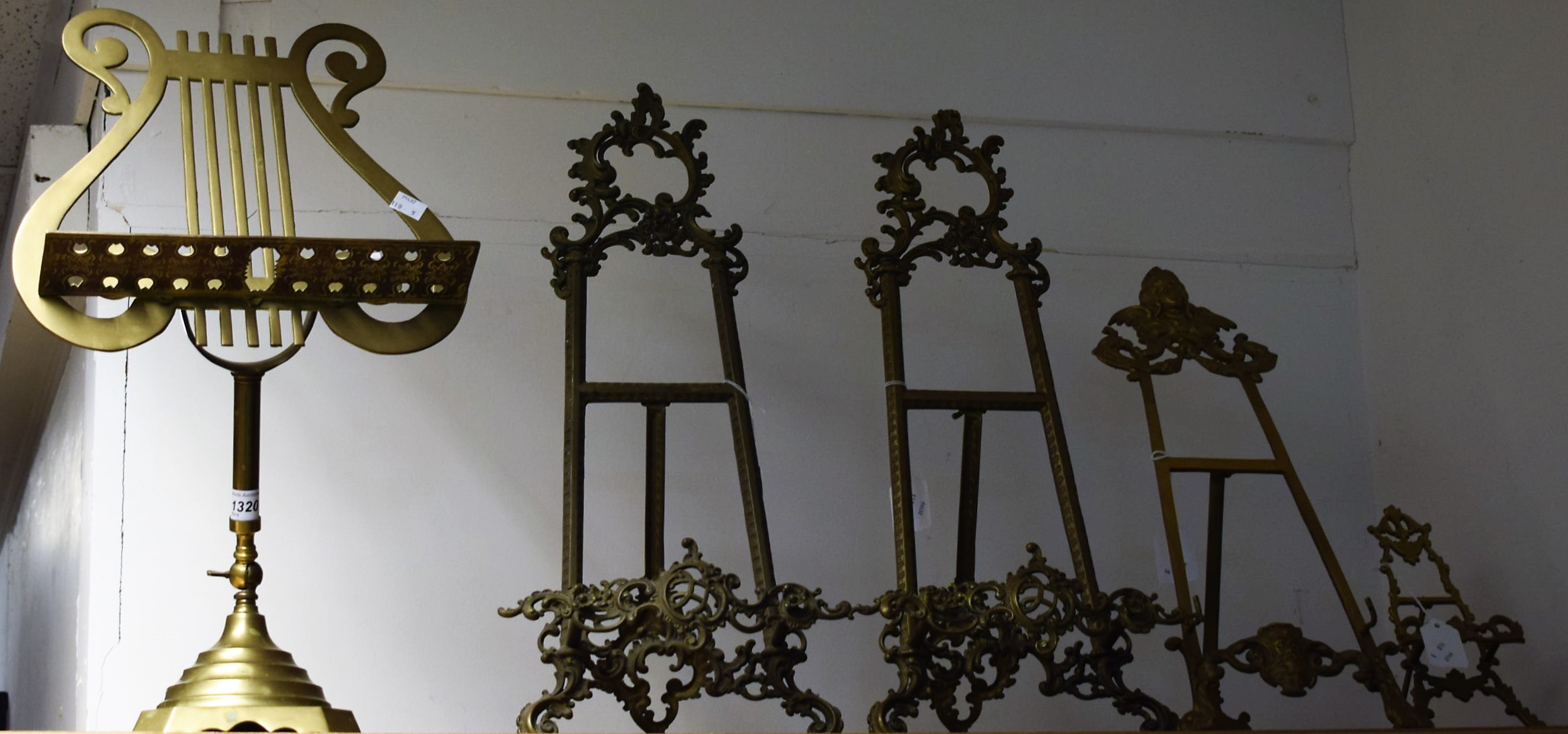 A brass Rococo style table easel, 53.