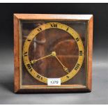 An Art Deco style walnut framed strut clock