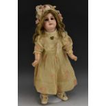 Simon & Halbig - a bisque head doll, fixed brown eyes, closed mouth, long blond hair,