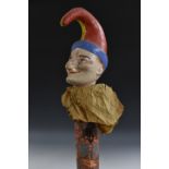 An early 20th century papier mache Pierrot tipped Polinchinelle staff, tapering floral shaft,