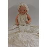 An Armand Marseille bisque head baby doll, sleeping blue eyes, closed mouth, incised AM 341,