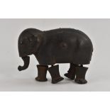 A Novelty cast iron walking elephant, stamped 'Patent 1873', 6.