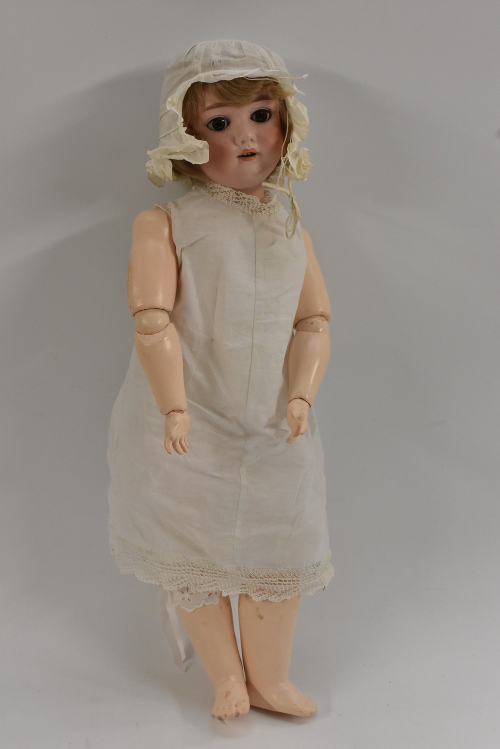 A Kley Hahn Walkure bisque head doll, with sleeping brown eyes, open mouth, four upper teeth,
