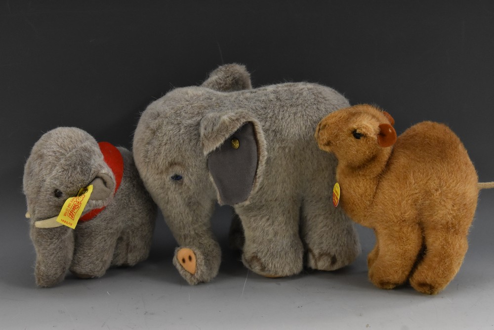 Steiff Stuffed Toys - a standing Elephant, large two tone ears, turned trunk, blue eyes, button,