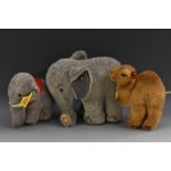 Steiff Stuffed Toys - a standing Elephant, large two tone ears, turned trunk, blue eyes, button,