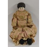 A late 19th / early 20th century pottery shoulder doll, moulded face, painted blue eyes,
