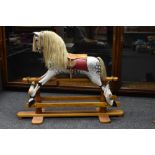 A handmade rocking horse, by Jim Presby, Wednesbourgh, dapple grey body, leather saddle and tack,