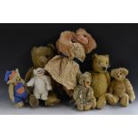 Teddy Bears - an early 20th century gold plush bear, centre seam, vertical stitched nose,