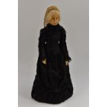 A late 19th century wax head doll, of Queen Victorian, in mourning dress, 42cm high, c.