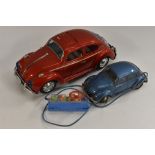 Bandai Toys - a 1960s battery operated tin plate Volkswagen Beetle Car, red.